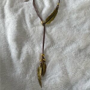Gold Tone Leaf Pendant Necklace in Brown Cord